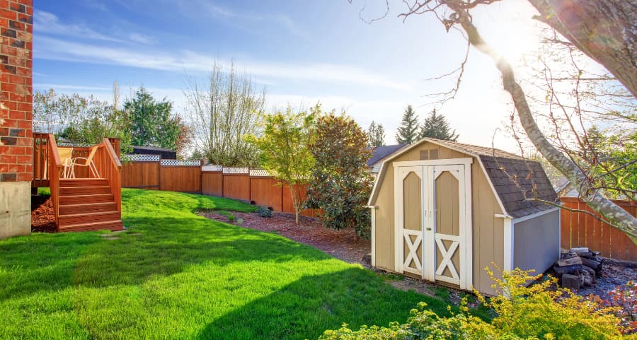 Fenced backyard with storage shed in Champaign